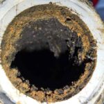 pipe clogged with dirt